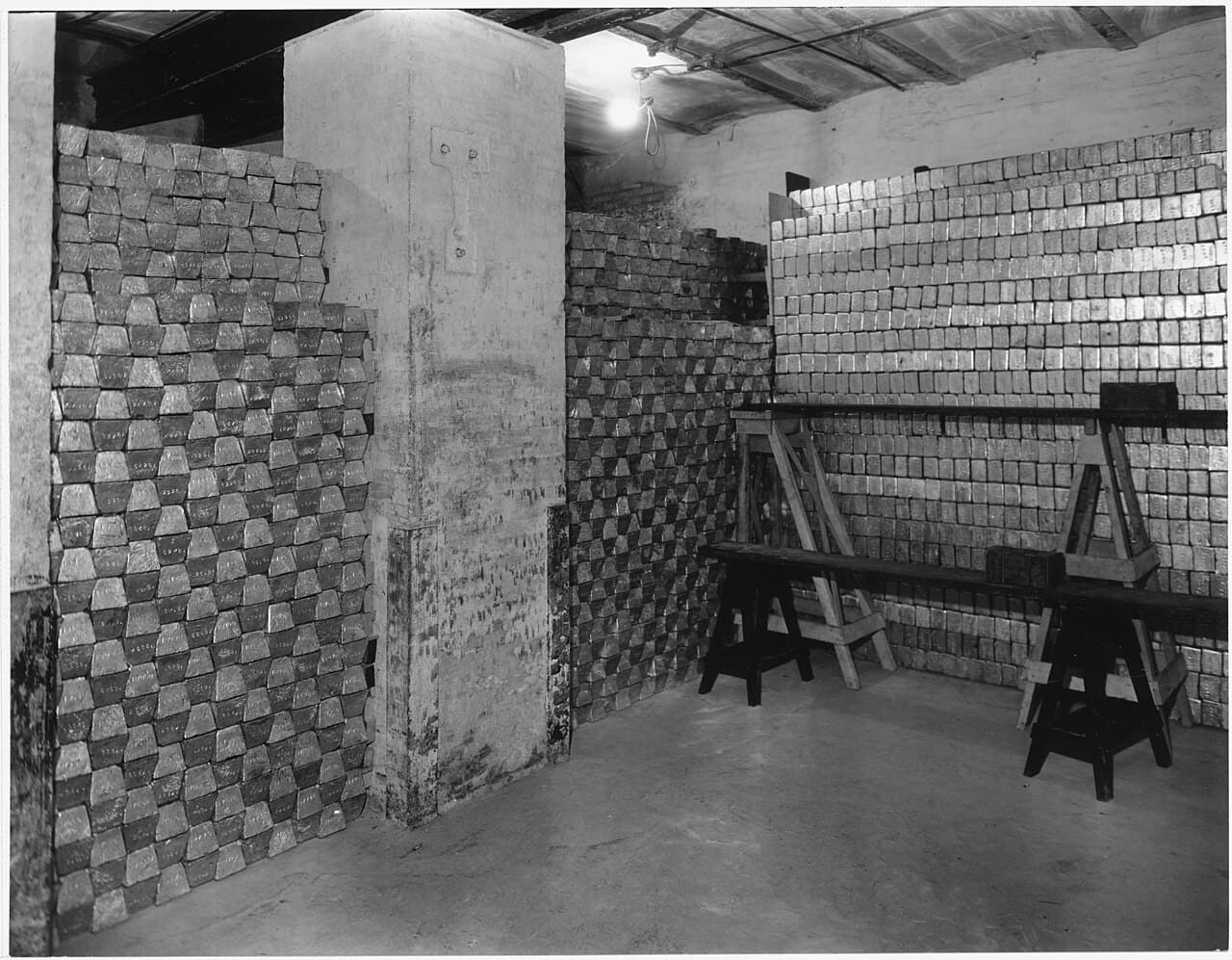 A U.S. Mint vault filled with stacked gold bars, representing Friday's strength in gold miners and defensive assets