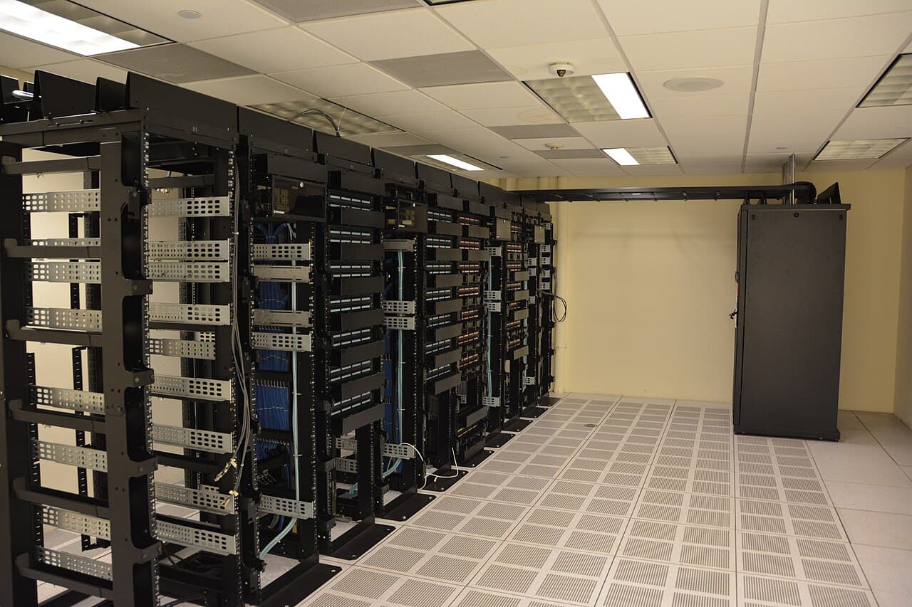 Rows of data-center server racks representing the AI infrastructure and semiconductor stocks in Monday's technology-stock forecast